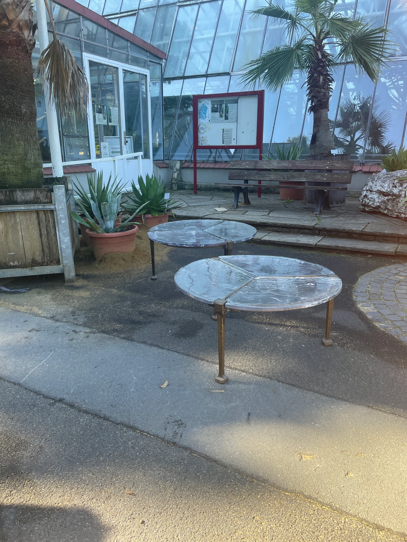 Glass tables outside the greenhouse.